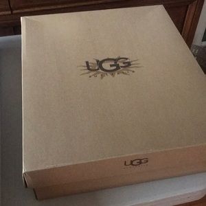UGG Zipper back black boots. NEVER WORN.